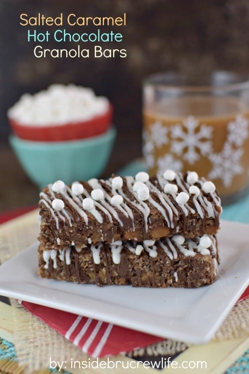 A white plate with two salted caramel hot chocolate granola bars stacked on it