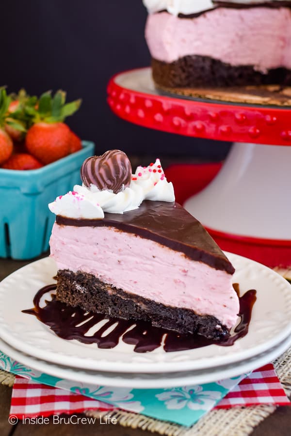 A chocolate covered strawberry dessert on a white serving plate.