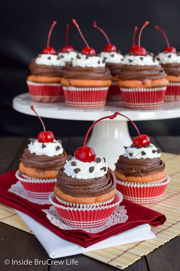 Cherry Chocolate Chip Cupcakes - adding cherries and chocolate chips to a box cake mix will create a fun bakery style cupcake! This easy recipe will get smiles from everyone! #cupcakes #cakemix #doctoredupcakemix #cherry #chocolate