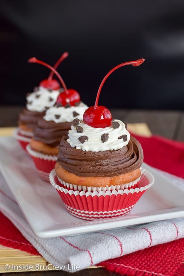 Cherry Chocolate Chip Cupcakes - doctor up a cake mix with chocolate chips and cherries to create a delicious bakery style cupcake. Try this easy recipe for parties! #cupcakes #cakemix #doctoredupcakemix #cherry #chocolate
