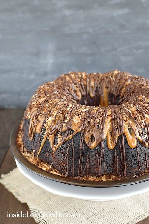 Chocolate and caramel drizzles turn this Chocolate Coconut Cake into a dessert master piece. It is absolutely amazing!