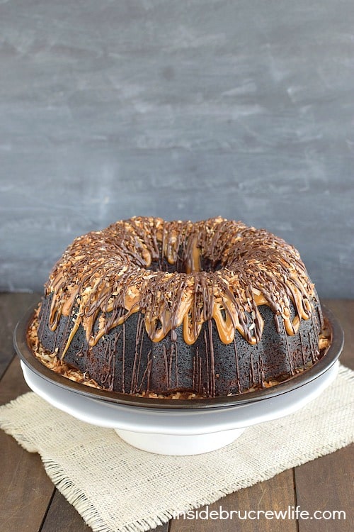 Chocolate and caramel drizzles turn this Chocolate Coconut Cake into a dessert master piece. It is absolutely amazing!