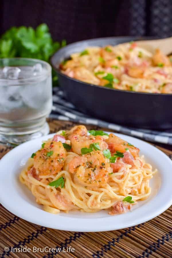 Spicy Parmesan Shrimp Scampi - pasta and shrimp in an easy cream sauce makes a delicious meal in under 30 minutes. Make this easy recipe on busy weeknights! #pasta #shrimp #shrimpscampi #easyrecipe #parmesan