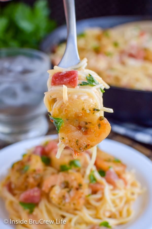 Spicy Parmesan Shrimp Scampi - shrimp and noodles in a creamy cheese sauce is the perfect dinner to make in a hurry. Easy comfort food recipe that is ready in under 30 minutes. #pasta #shrimp #shrimpscampi #easyrecipe #parmesan
