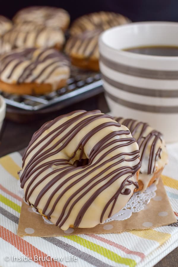 Mocha Chocolate Chip Donuts - these homemade baked donuts are loaded with coffee and chocolate chips. Easy recipe to make for breakfast or after school snacks. #donuts #homemade #chocolatechip #mocha #coffee #breakfast