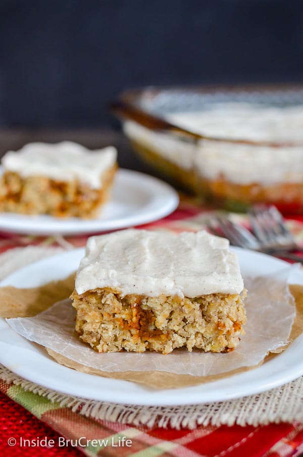 Frosted Cinnamon Apple Bars - these easy oatmeal bars are loaded with apples and cinnamon chips and topped with a creamy cinnamon frosting. Easy recipe to make this fall. #apple #oatmealbars #cinnamon #frosting #fall