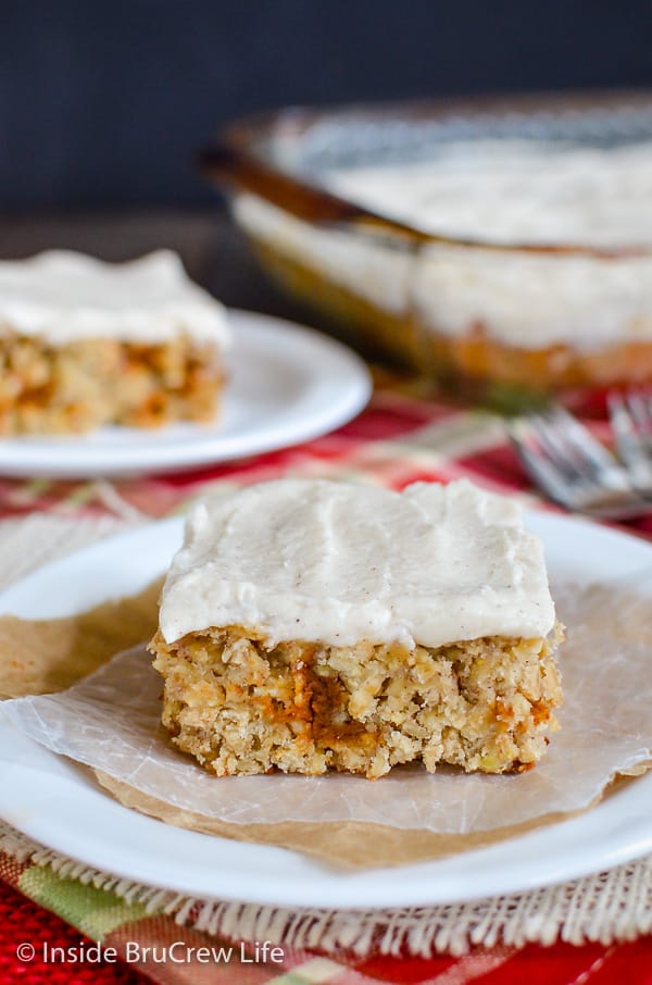 Frosted Cinnamon Apple Bars - the creamy cinnamon frosting on these homemade apple bars is a must. Make this easy recipe this fall and watch everyone smile! #apple #oatmealbars #cinnamon #frosting #fall