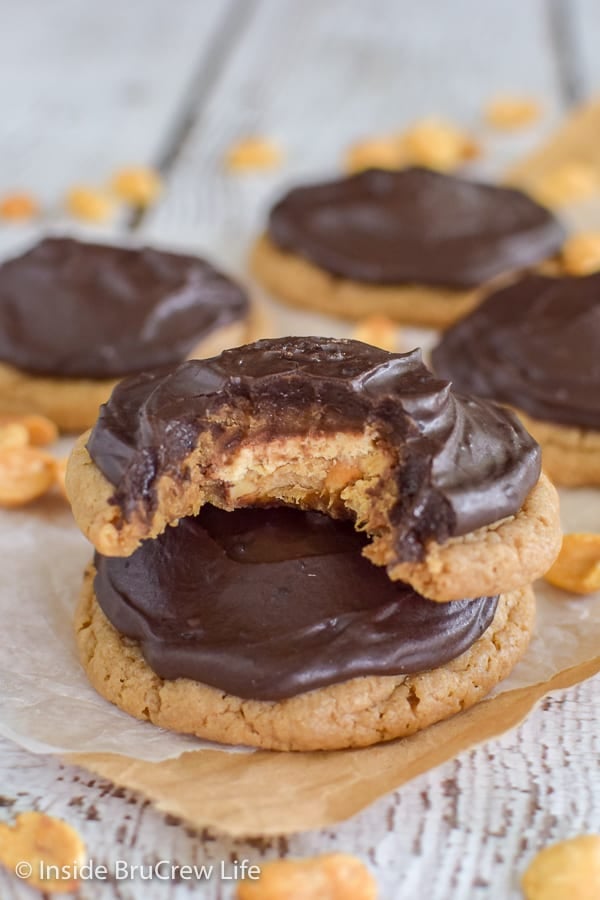 Caramel Peanut Butter Snickers Cookies - cake mix cookies stuffed with candy bars are a sweet treat. Try this fun recipe for dessert.