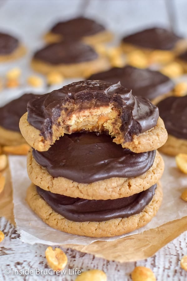 Caramel Peanut Butter Snickers Cookies - candy bars and a chocolate glaze make these cake mix cookies taste amazing. Make this easy recipe for dessert.