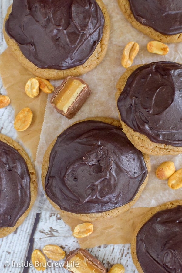 Caramel Peanut Butter Snickers Cookies - caramel cake mix cookies stuffed with Snickers are a fun treat to fill the cookie jar with. Try this easy recipe for dessert.
