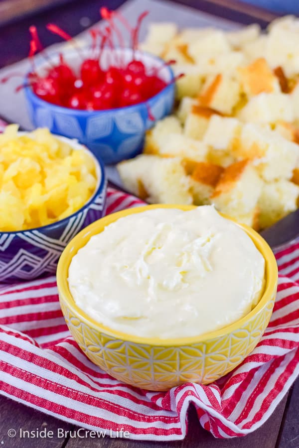 Pina Colada Cake Trifle - no bake coconut cheesecake, pineapple cake, and fruit layered together makes an amazing cake trifle. Easy recipe for summer parties! #pinacolada #coconut #trifle #nobakecheesecake #cakemix #caketrifle