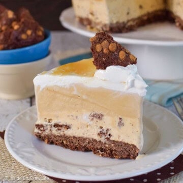 A slice of caramel ice cream cake on a white plate.