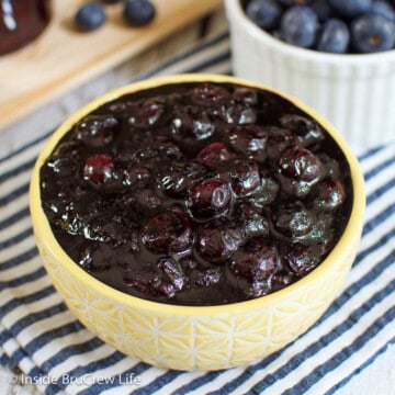 Homemade blueberry sauce in a yellow bowl.