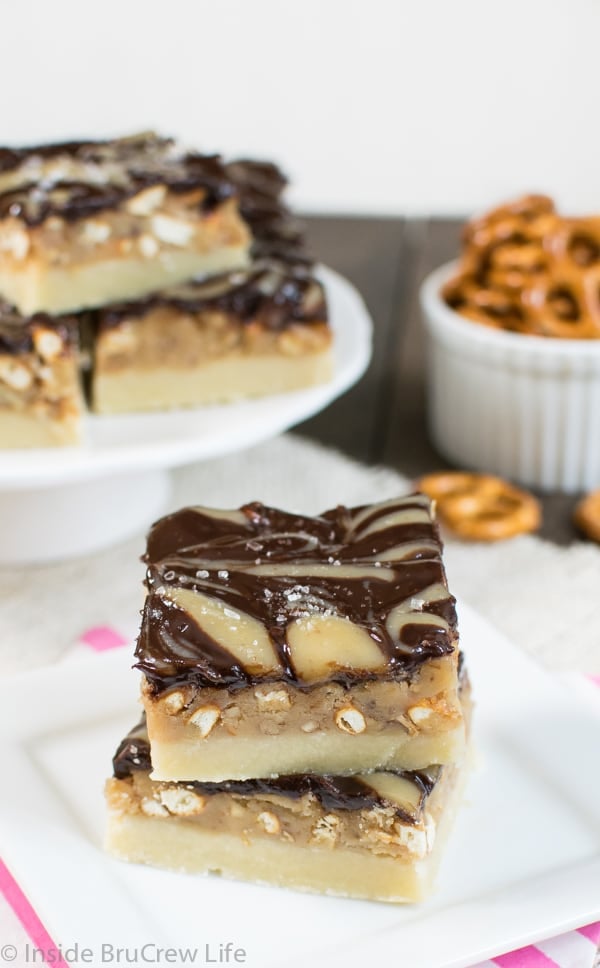 These salted caramel squares have a pretzel and pecan center. These cookie bars have a fun sweet and salty twist.