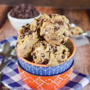 Scoops of brownie batter ice cream in a stack of bowls.