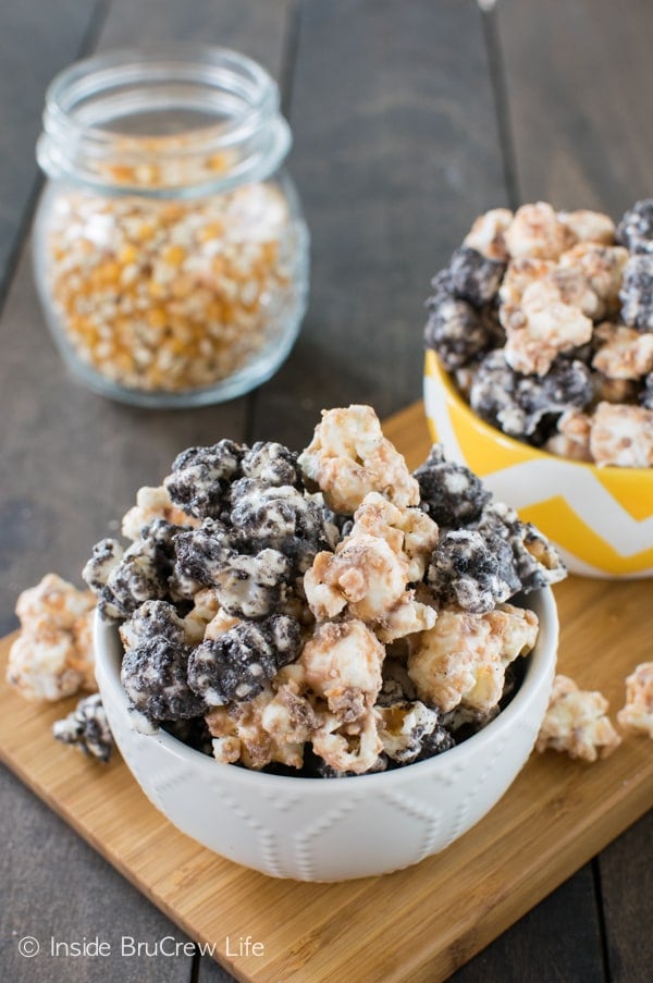 Mixing Oreo crumbs and Butterfinger bits makes this easy white chocolate popcorn disappear every time we make it!