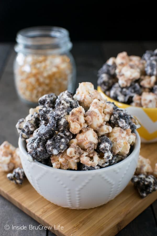 White chocolate covered popcorn coated in Oreo cookies and Butterfinger candy makes a fun and delicious snack mix.