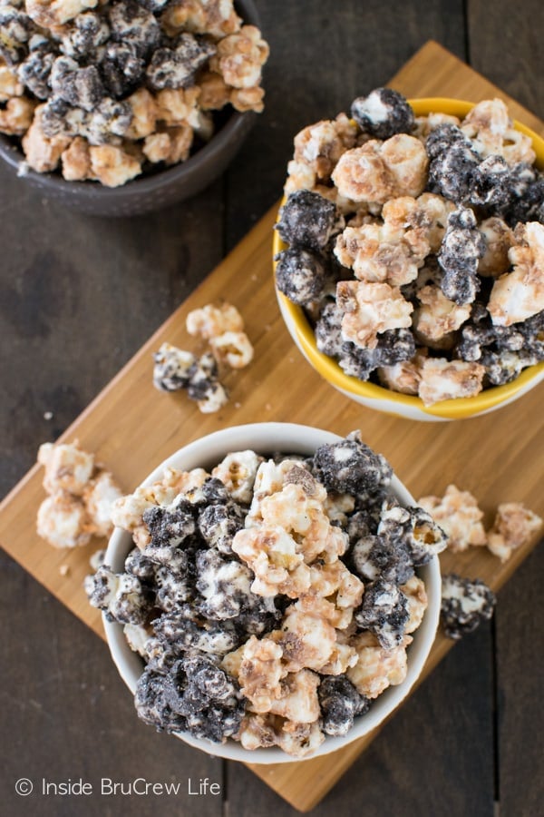 Covering white chocolate popcorn in Butterfinger bits and Oreo crumbs makes a delicious treat.