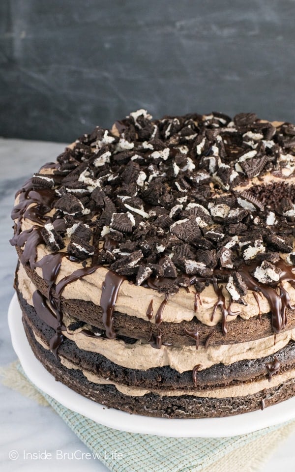 An above picture of a full mississippi mudslide cake topped with coffee whipped cream and Oreos