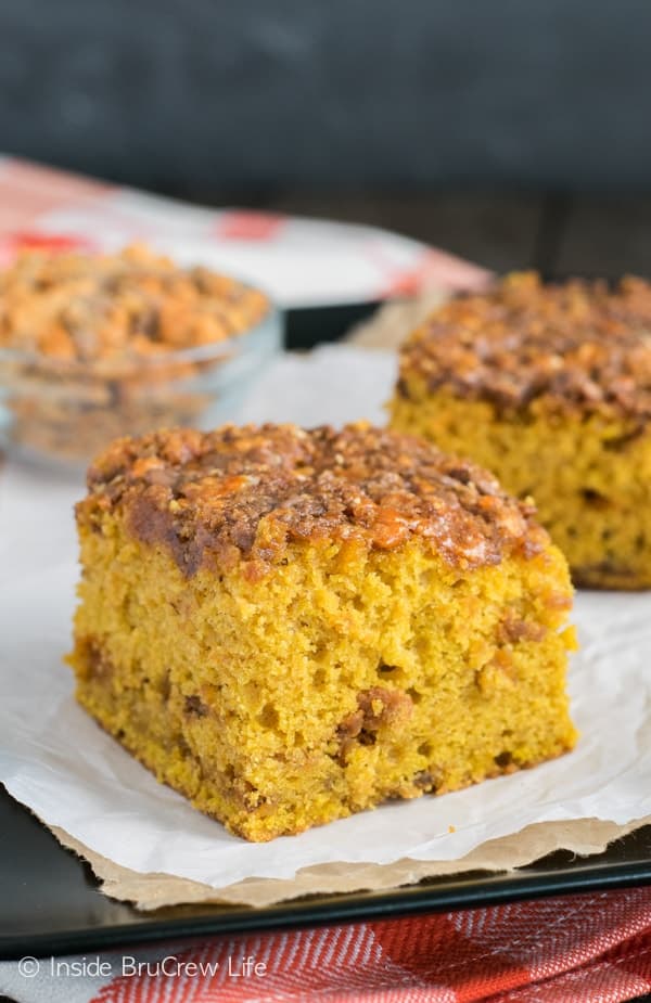 This easy pumpkin cake has a gooey Butterfinger and brown sugar topping! It's the perfect fall dessert!