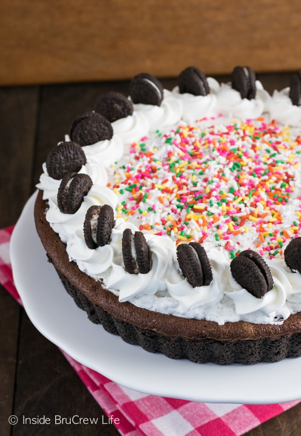 This fudge tart is topped with a cookies and cream filling making it an awesome chocolate dessert to share!