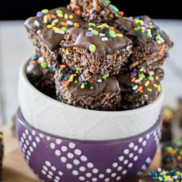 Two bowls stacked together and filled with chocolate granola bar bites