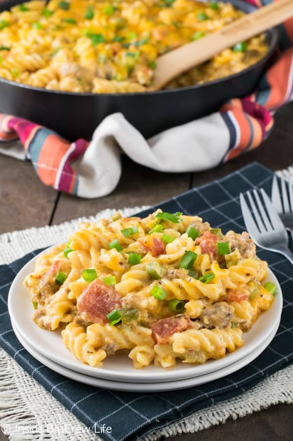 This easy pasta skillet dinner is loaded with cheese, tomatoes, and sausage and is ready in 30 minutes.  Perfect comfort food for busy nights! 