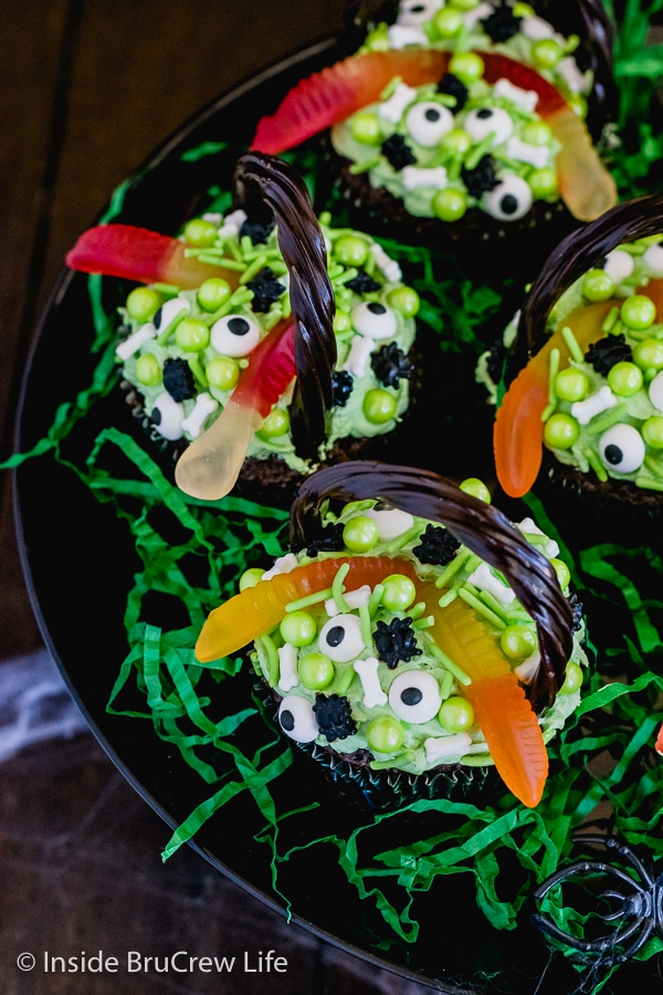 Overhead picture of the top of Witch's Cauldron Brownie Cupcakes on a black cake plate