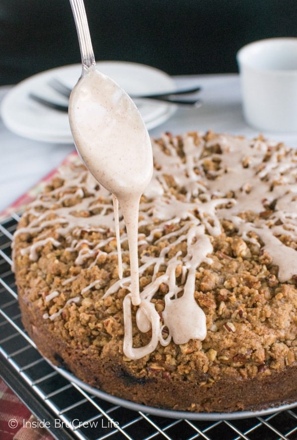 Drizzling glaze over the crumble topping on this Apple Cranberry Coffee Cake is a very good breakfast idea.