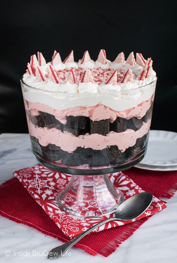 A large clear glass bowl filled with Peppermint Brownie Trifle.