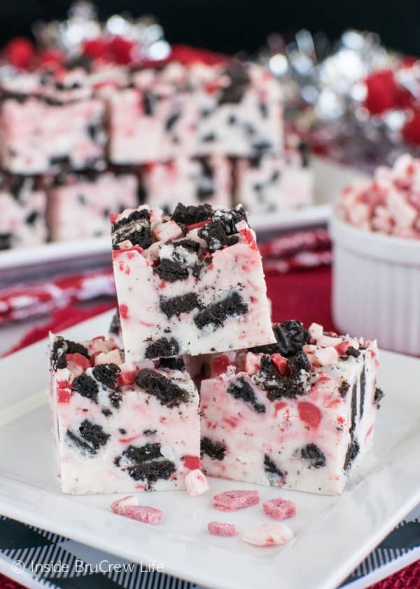 This easy Peppermint Cookies and Cream Fudge is loaded with cookies and peppermint swirls. Perfect holiday dessert for the cookie trays this Christmas.