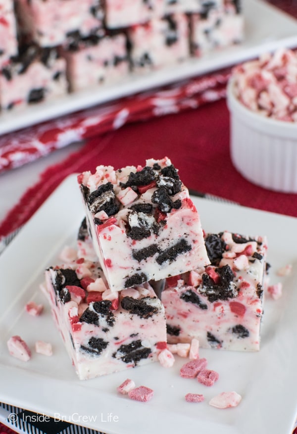 Adding cookies and peppermint chips makes this easy Peppermint Cookies and Cream Fudge an awesome Christmas dessert.