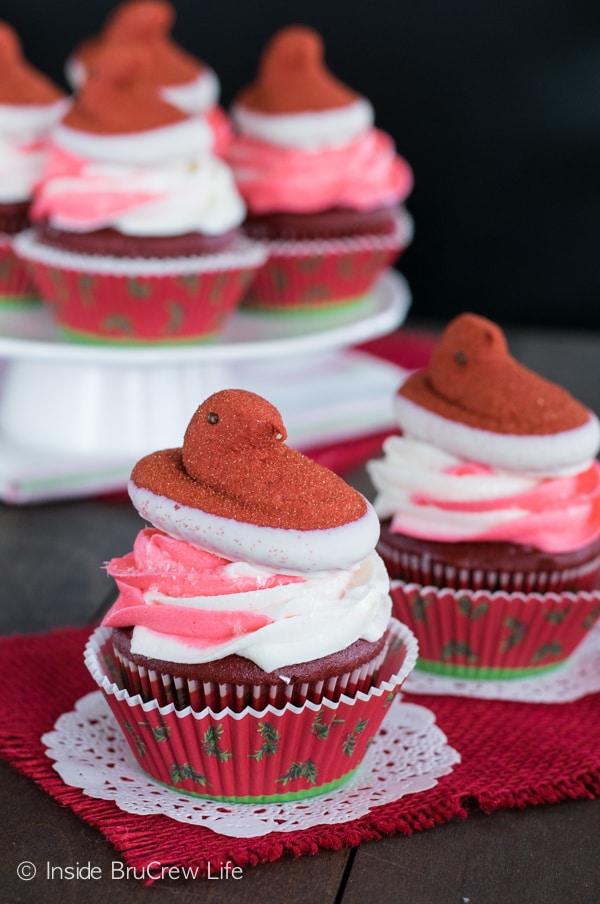 Swirls of peppermint frosting and a PEEPS® marshmallow chick make these Red Velvet Cupcakes the perfect holiday party treat!