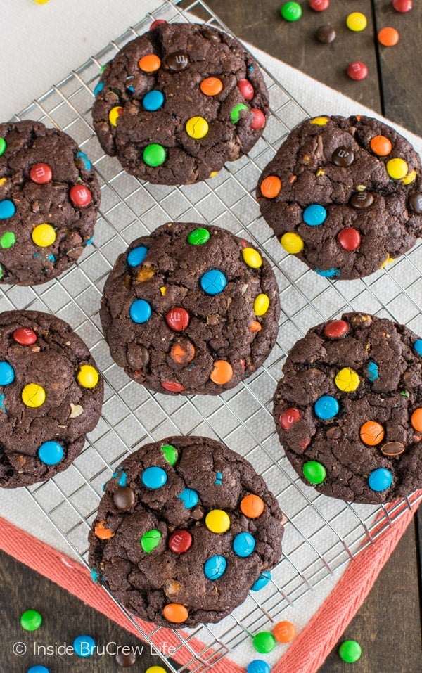 Butterfinger bits and mini M&M's make these easy Chocolate Candy Cookies disappear in a hurry. Great dessert recipe!