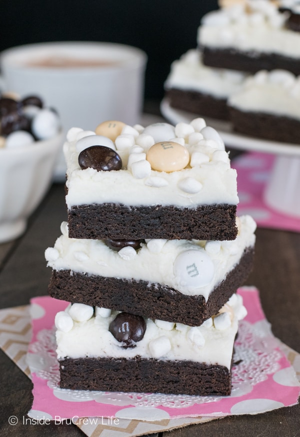 Marshmallow frosting with candy and marshmallow bits adds a fun twist to these Mocha Hot Chocolate Cookie Bars. Great dessert recipe!