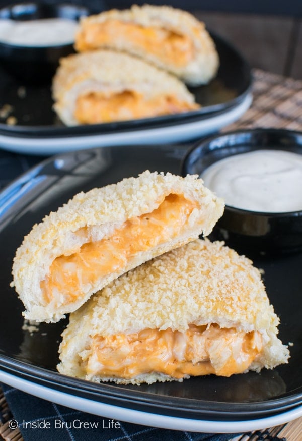 Chicken dip and biscuits create awesome Buffalo Chicken Calzones. Easy dinner recipe or game day appetizer!