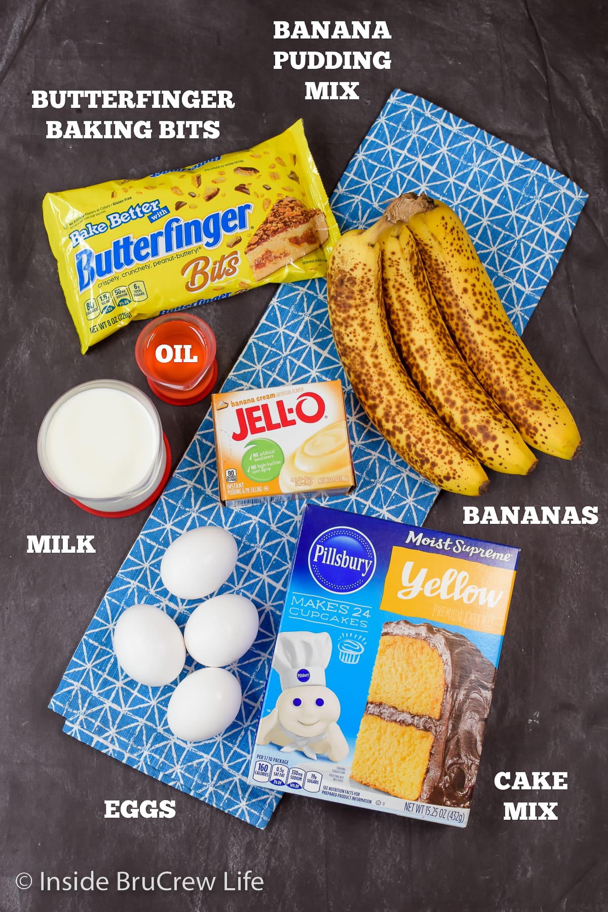 A black board with the ingredients to make a banana cake on it.