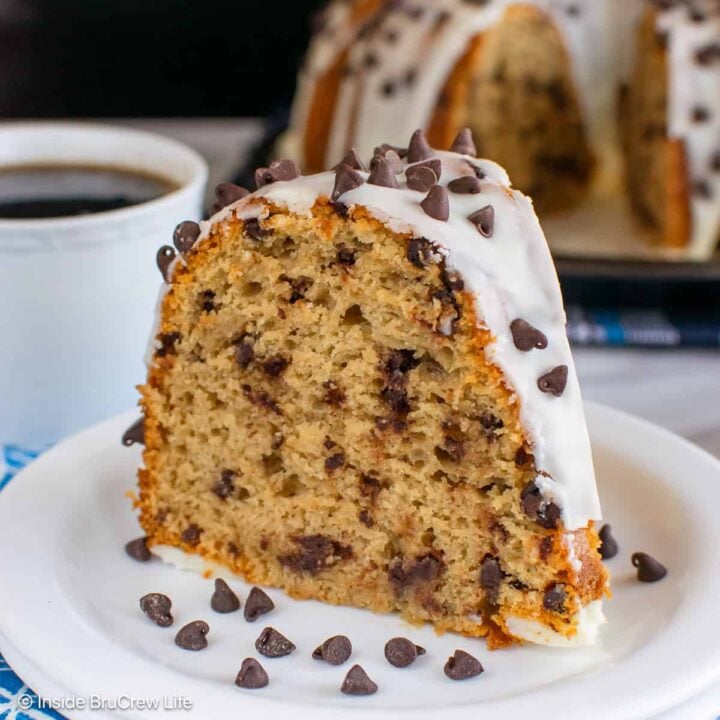A white plate with a slice of coffee flavored bundt cake on it.