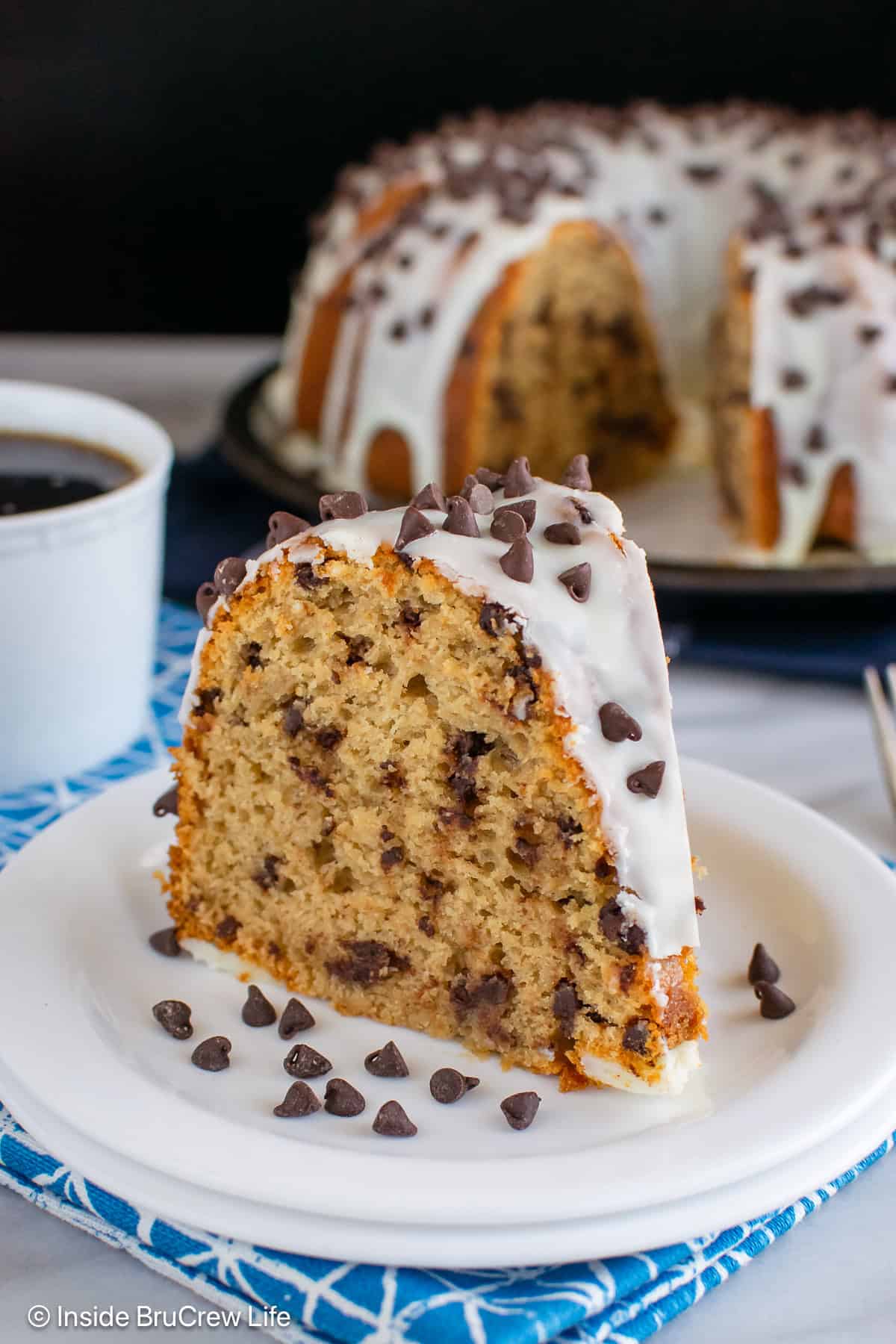 A slice of coffee bundt cake on a white plate.