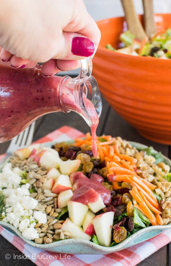 Cranberry Poppyseed Apple Salad - this bright salad is loaded with nuts and fruit. Great recipe for picnics or dinner parties.