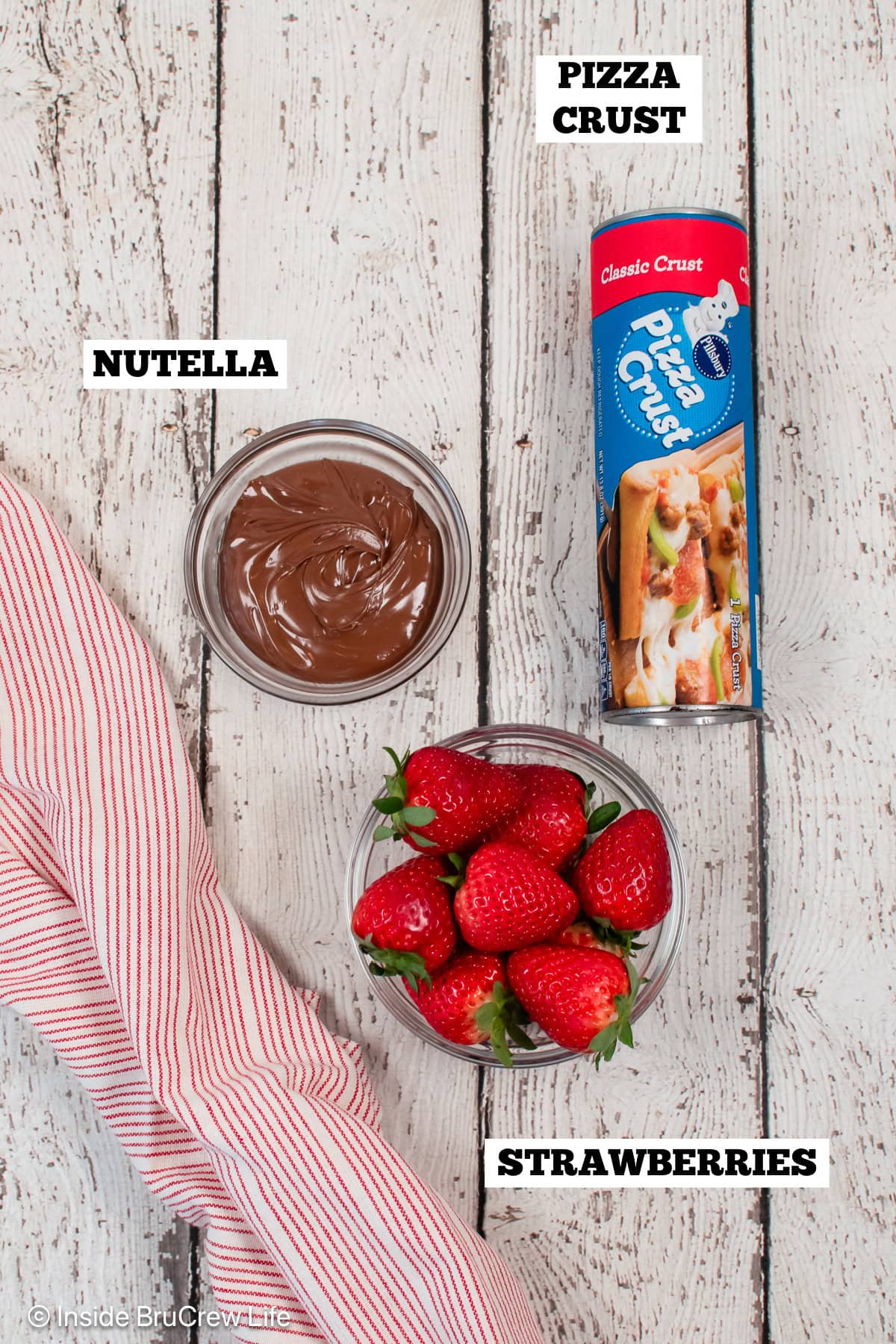 Ingredients to make nutella twists on a white board.