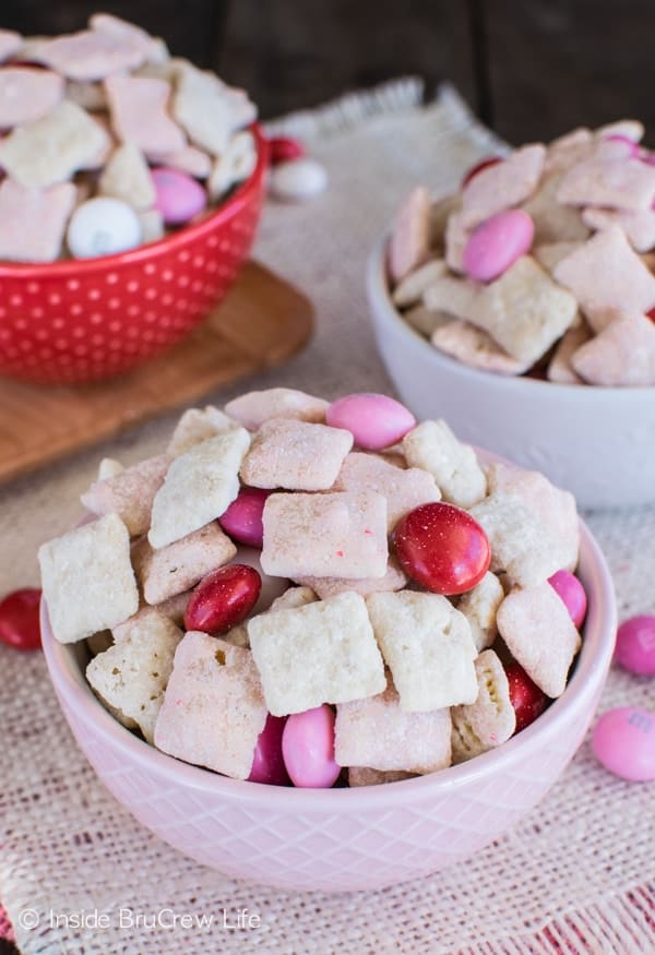 Strawberry Shortcake Muddy Buddies - this easy snack mix is coated in cookie crumbs and cake mix for a fun twist. Great dessert recipe for Valentine's day or summer picnics!