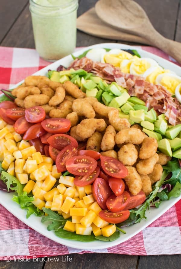 Avocado Shrimp Cobb Salad - layers of meat, veggies, and cheese make this pretty salad recipe a great dinner choice.