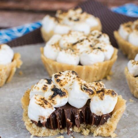 Mini S'mores Pie with a bite taken out with a fork showing the gooey chocolate center