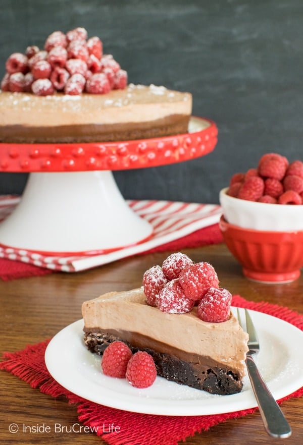 Brownies, frosting, & Nutella layers make this Raspberry Nutella Brownie Cake a fun dessert recipe to try!