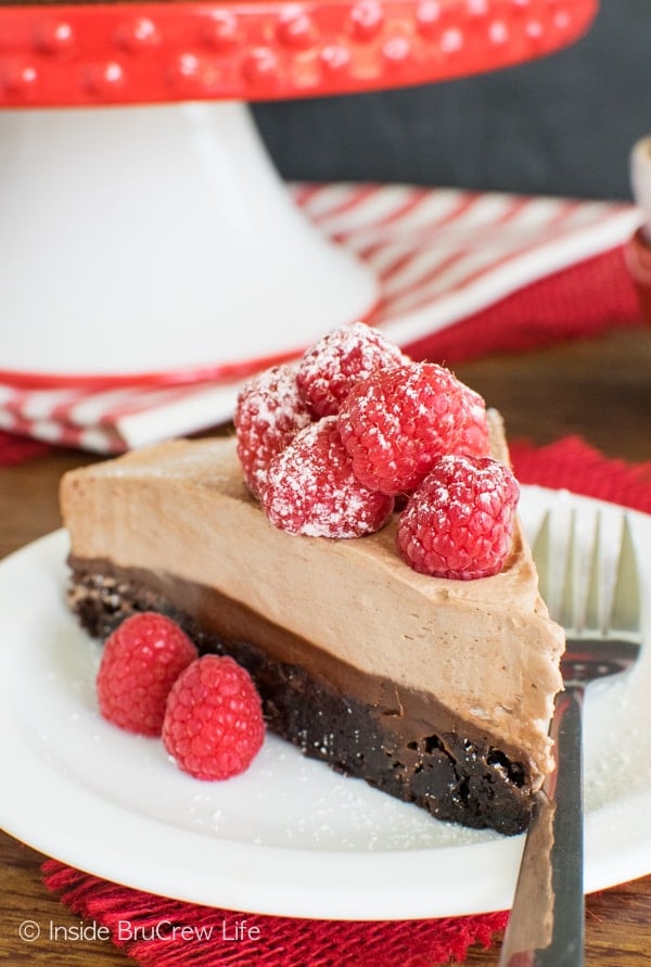 Three layers of chocolate topped with fresh raspberries makes this Raspberry Nutella Brownie Cake the best dessert recipe. You need it in your life!