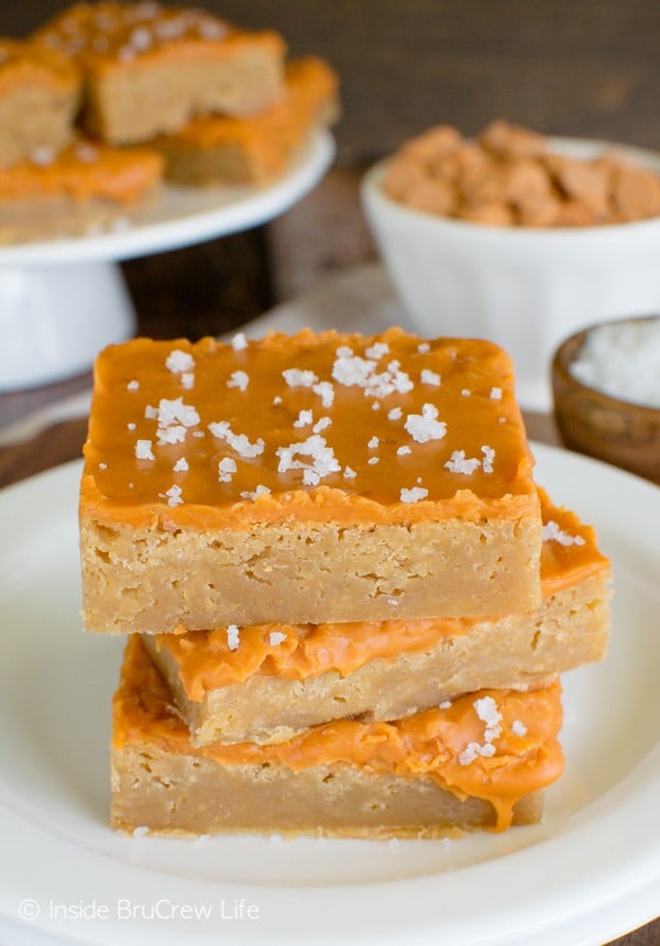 Three Salted Butterscotch Bars stacked on a white plate