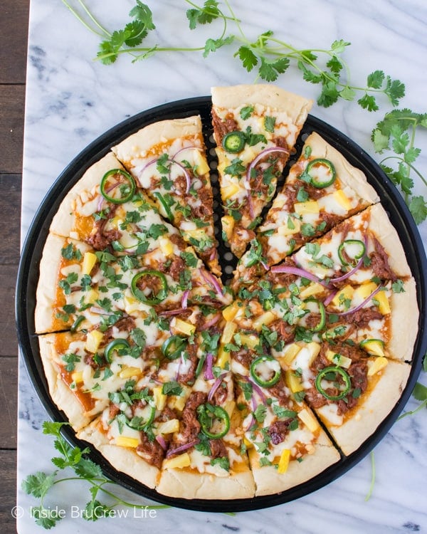 Sweet and spicy toppings make this BBQ Pork Pineapple Pizza a new family favorite dinner recipe.