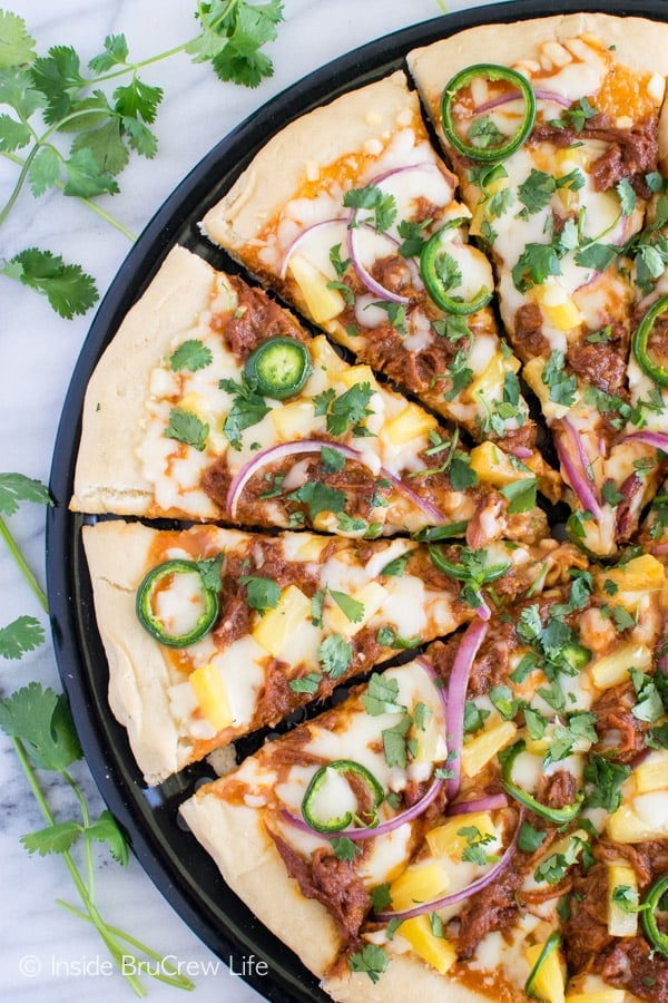 Pineapple and jalapeños add a sweet and spicy flair to this BBQ Pork Pineapple Pizza. Awesome summer dinner recipe! 