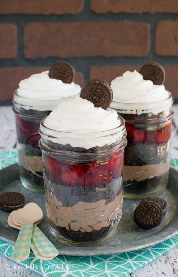 Cherry Chocolate Mousse Parfaits - layers of cherry pie filling, cookie crumbs, and chocolate mousse make these a fun summer treat. Great no bake recipe!